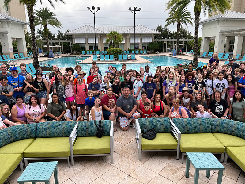 students group around pool